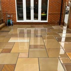 Image shows mix of sizes in a patio pack. The wet patio slabs help display the natural colours 